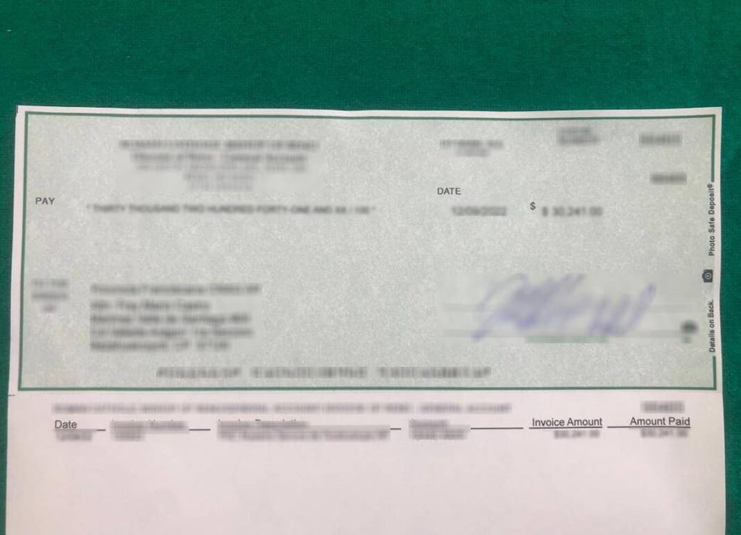 Aseguran cheque por 127 mil dólares en empresa de paquetería de Querétaro